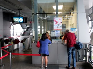 people buying tokens at Phaya Thai ticket counters