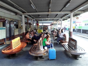 people waiting for a train at platform 1