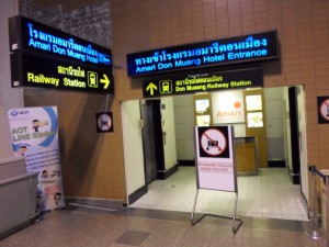 sign for the train station and Amari hotel