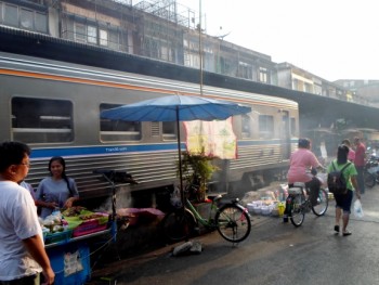 View of a train leaving the station from the street